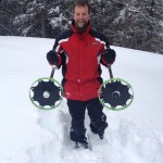Snowshoes attached to bottom of crutches